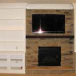 basement-fireplace-white-shelves-tv
