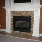 fireplace-colored-stone-white-mantel